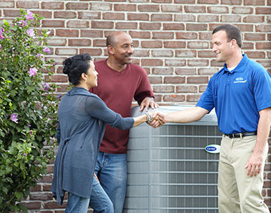 RJ-Landing-Image-3 HVAC technician discussing repairs with the homeowners